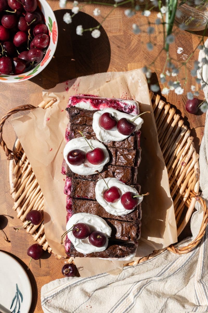 Flat lay of the cherry brownie ice cream sandwiches on a tray.