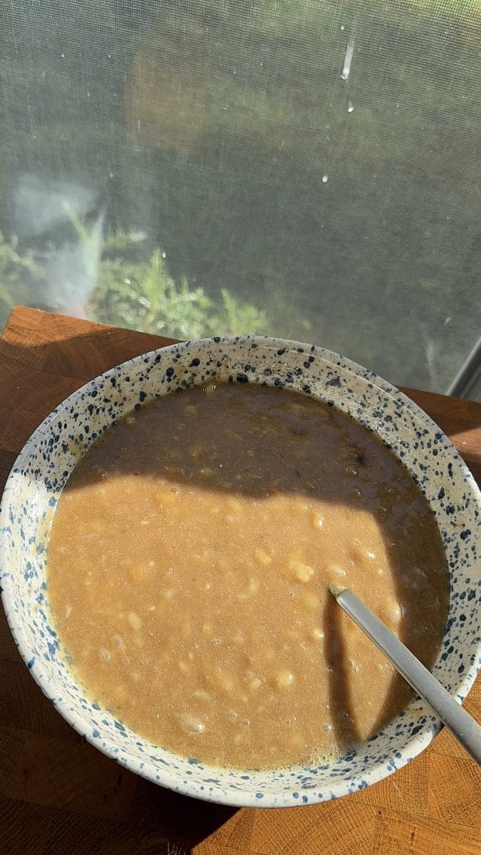 All of the wet ingredients whisked together in a mixing bowl.