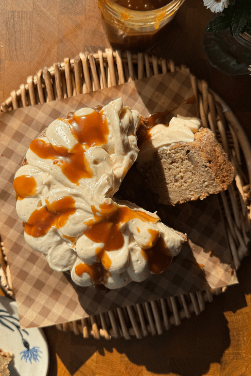 Overhead view of the salted caramel banana cake with a slice cut out of it.
