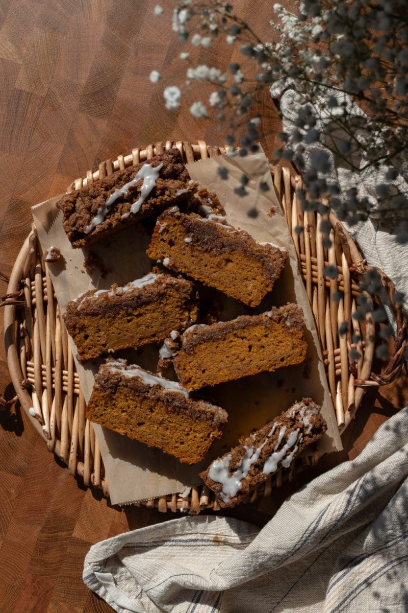 The pumpkin coffee cake sliced up on a serving tray.
