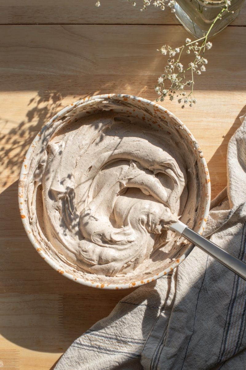 Coffee mascarpone whipped cream in a mixing bowl.