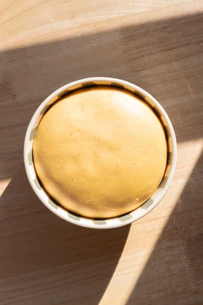 The pumpkin brioche dough in a mixing bowl.