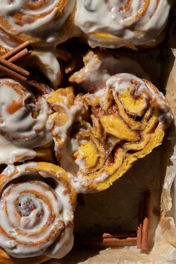 Close up cross-section of one of the pumpkin cinnamon rolls.