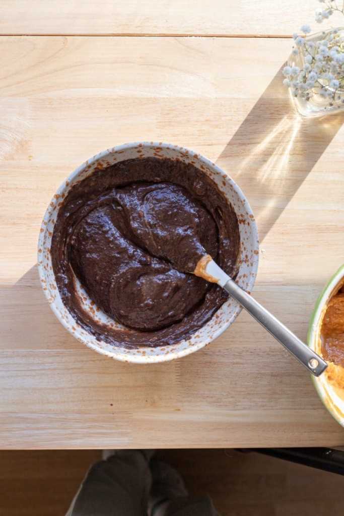 The chocolate batter in a small mixing bowl.