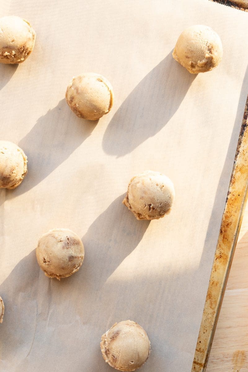 The cookie dough portioned out on a baking tray.