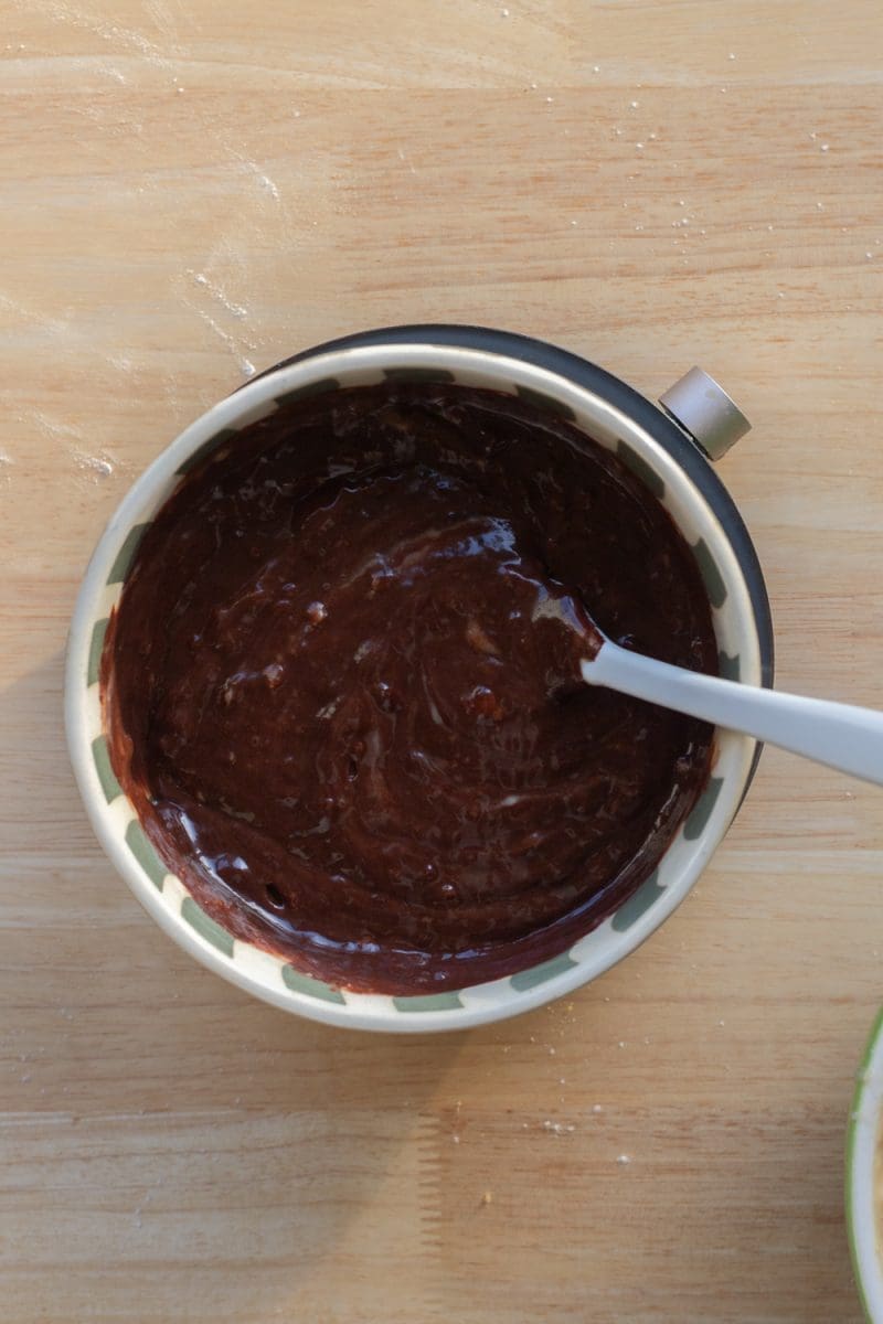 Chocolate banana cake batter in a mixing bowl.