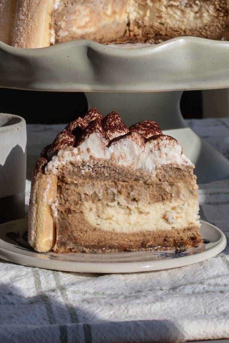 Close up of a slice of tiramisu cheesecake.