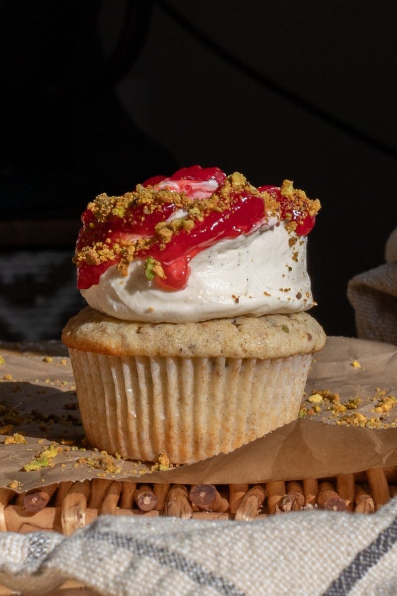 Close up of one of the small batch pistachio cupcakes.