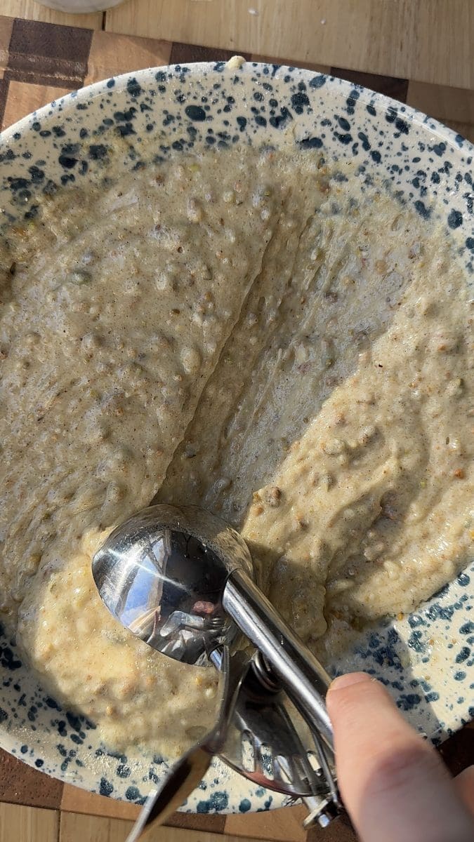 Scooping up the pistachio batter.