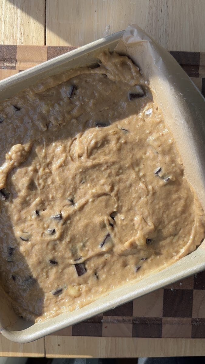 The batter in a lined baking pan.
