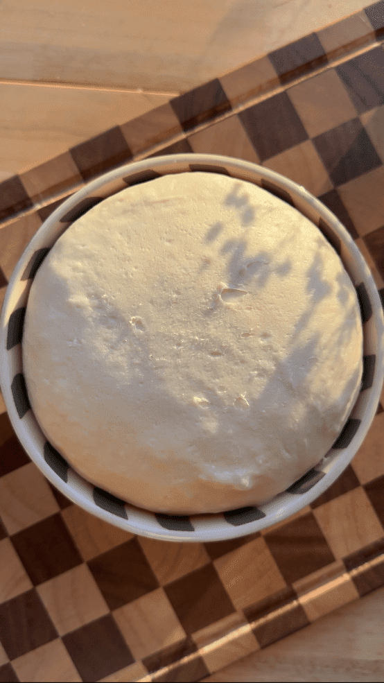 Brioche dough in a mixing bowl.