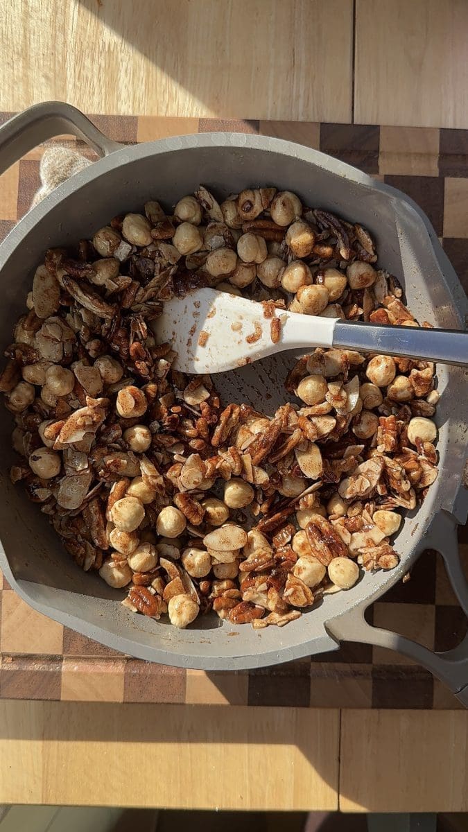The honey praline mixture in a saucepan.