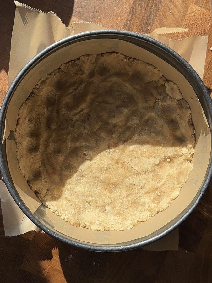 Shortbread crust pressed into a springform pan.