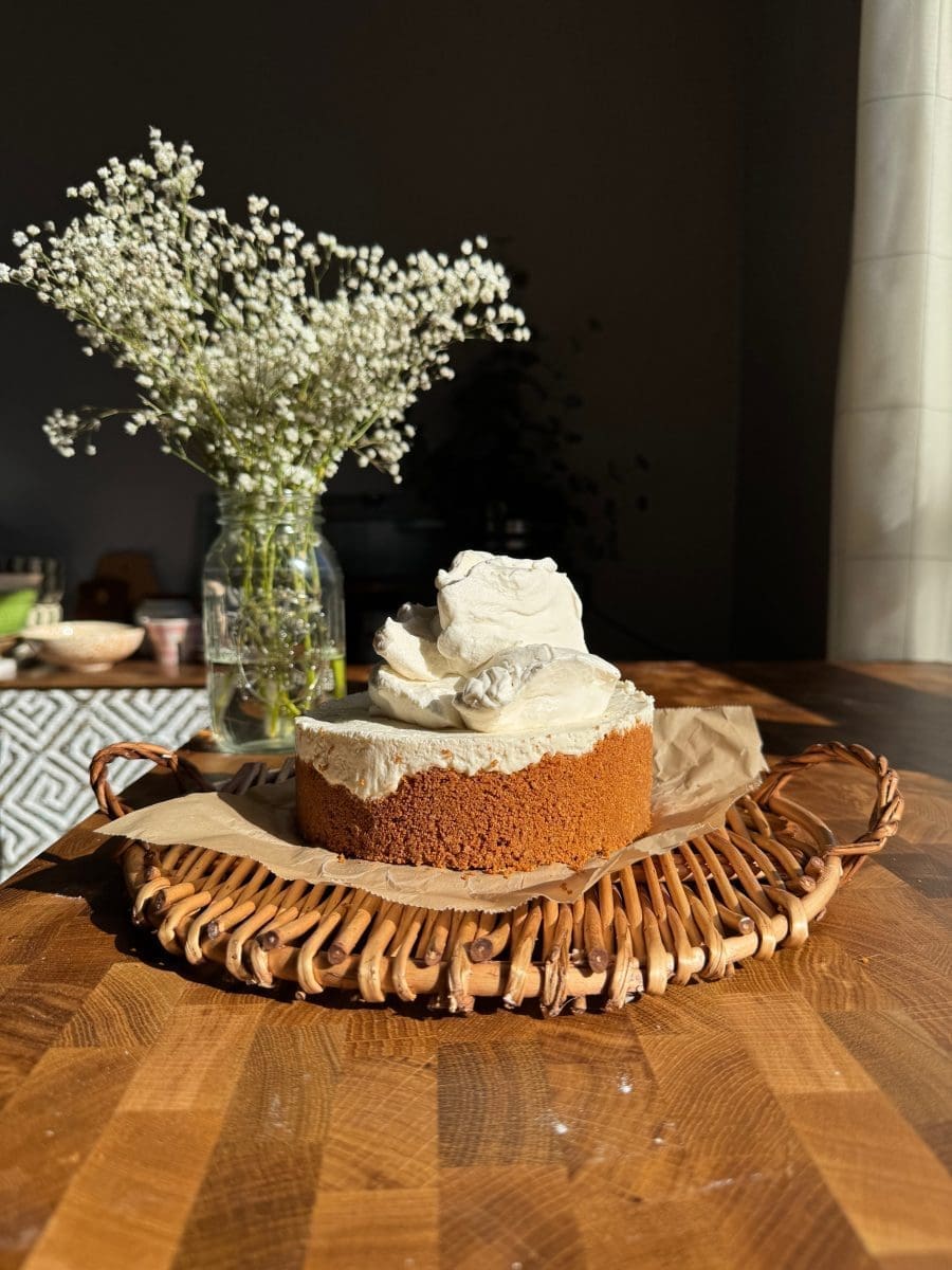 Whipped cream piled on top of the cheesecake.