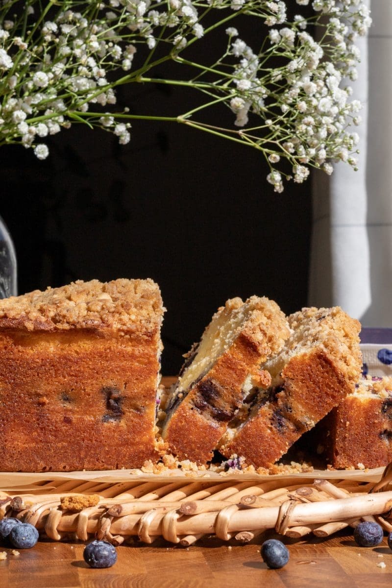 Side view of the sliced lemon blueberry loaf.