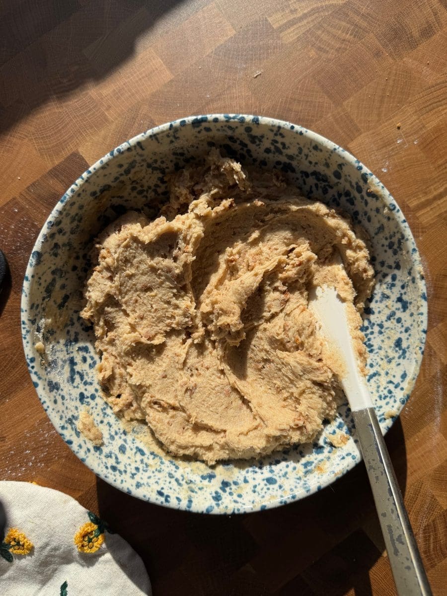 The finished banoffee pie cookie dough in a mixing bowl.