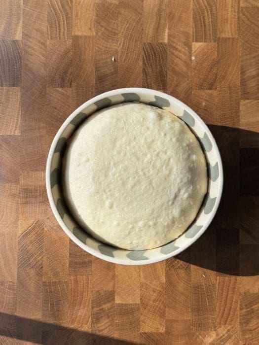 Brioche dough in a mixing bowl.