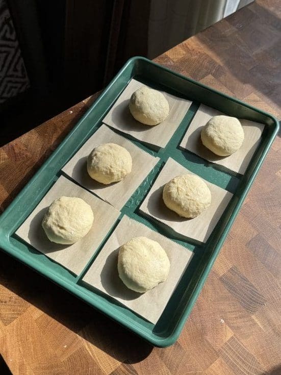 The donuts on parchment squares.