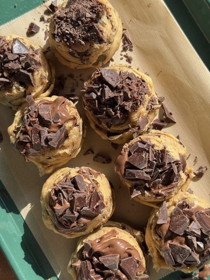 The finished cookie dough topped with nutella and chocolate chips.