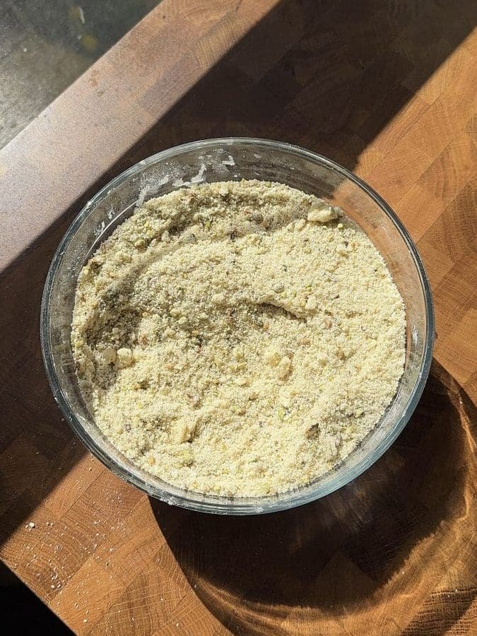 The dry ingredients and butter beaten together in a large mixing bowl.