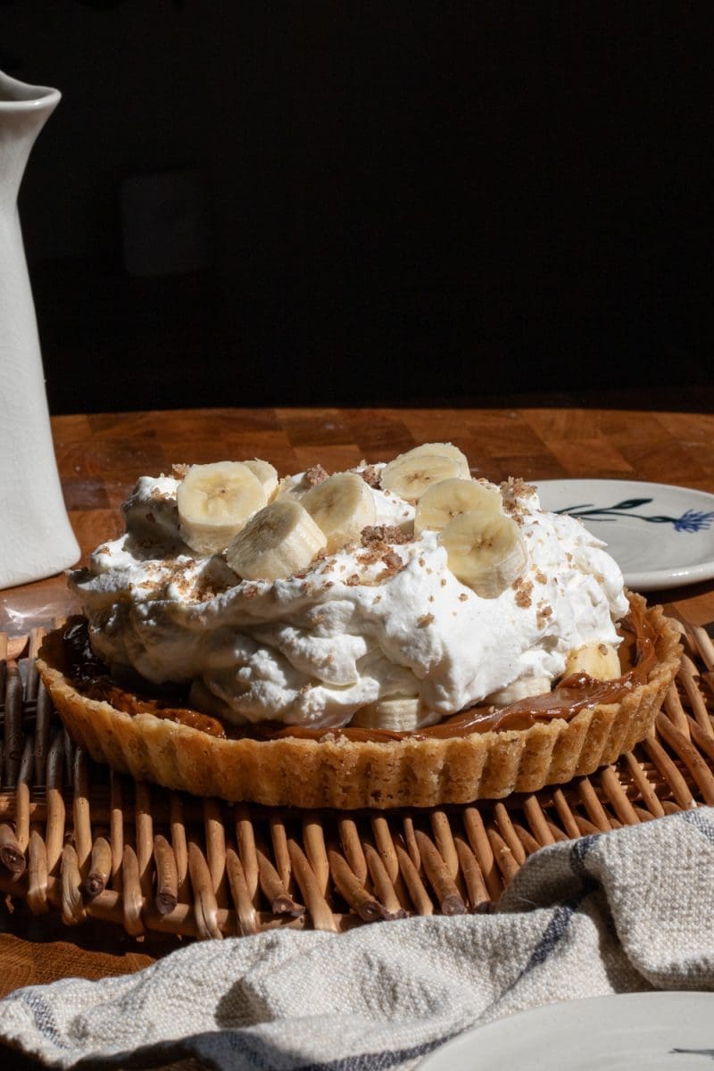 Close up of the fully assembled salted hazelnut banoffee pie
