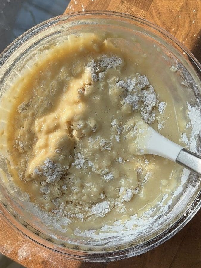 The flour almost fully incorporated into the batter.