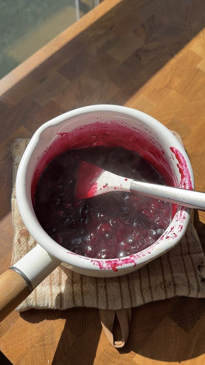 Blueberry jam in a saucepan.