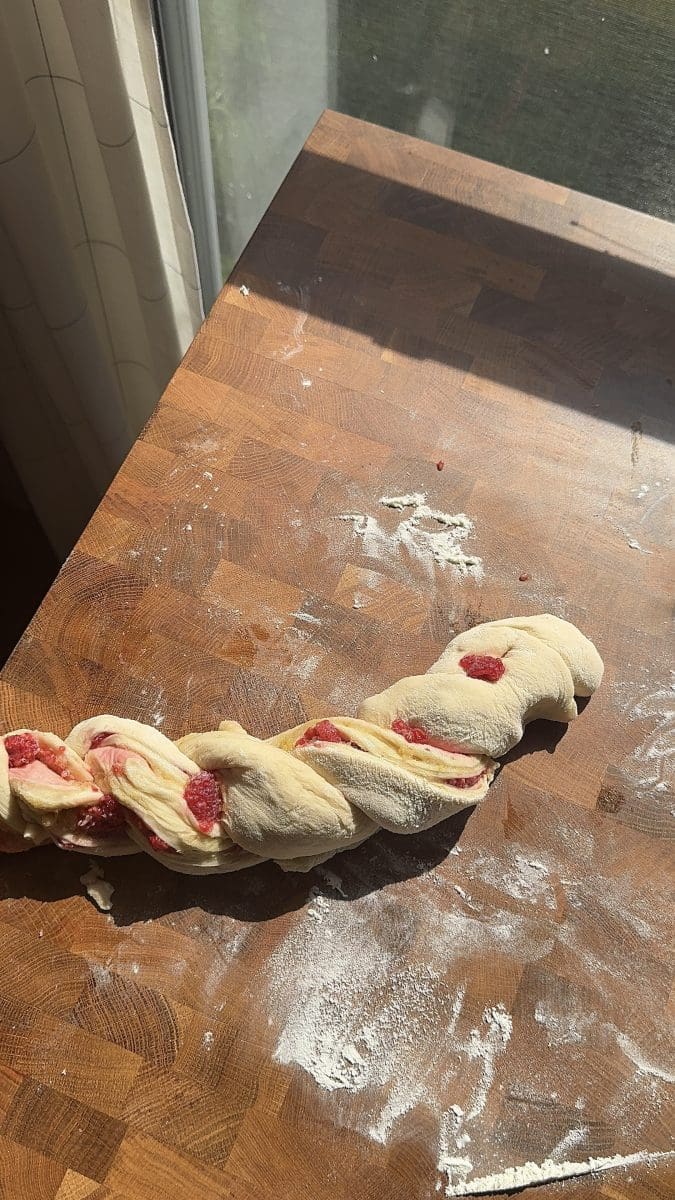 Twisting the dough up.