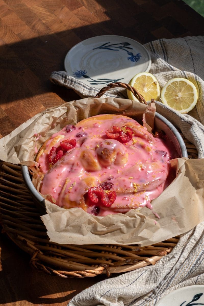 The giant lemon raspberry brioche bun on a serving tray.