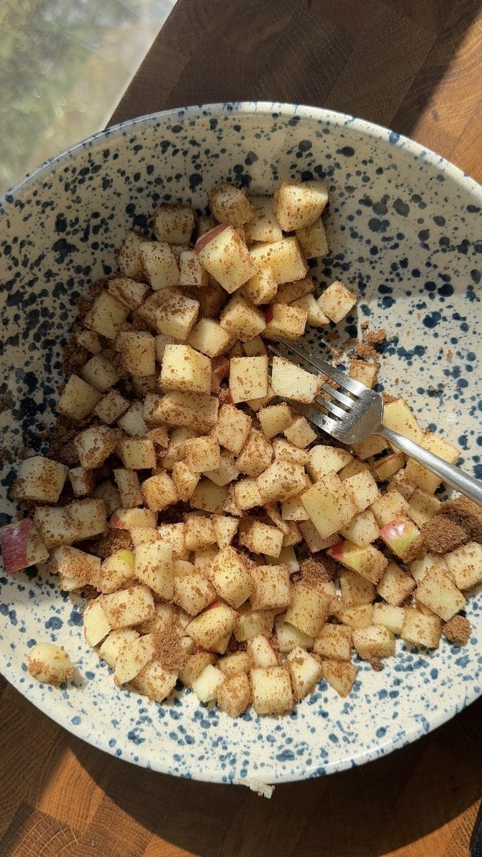 The apples mixed with apple pie spiced sugar