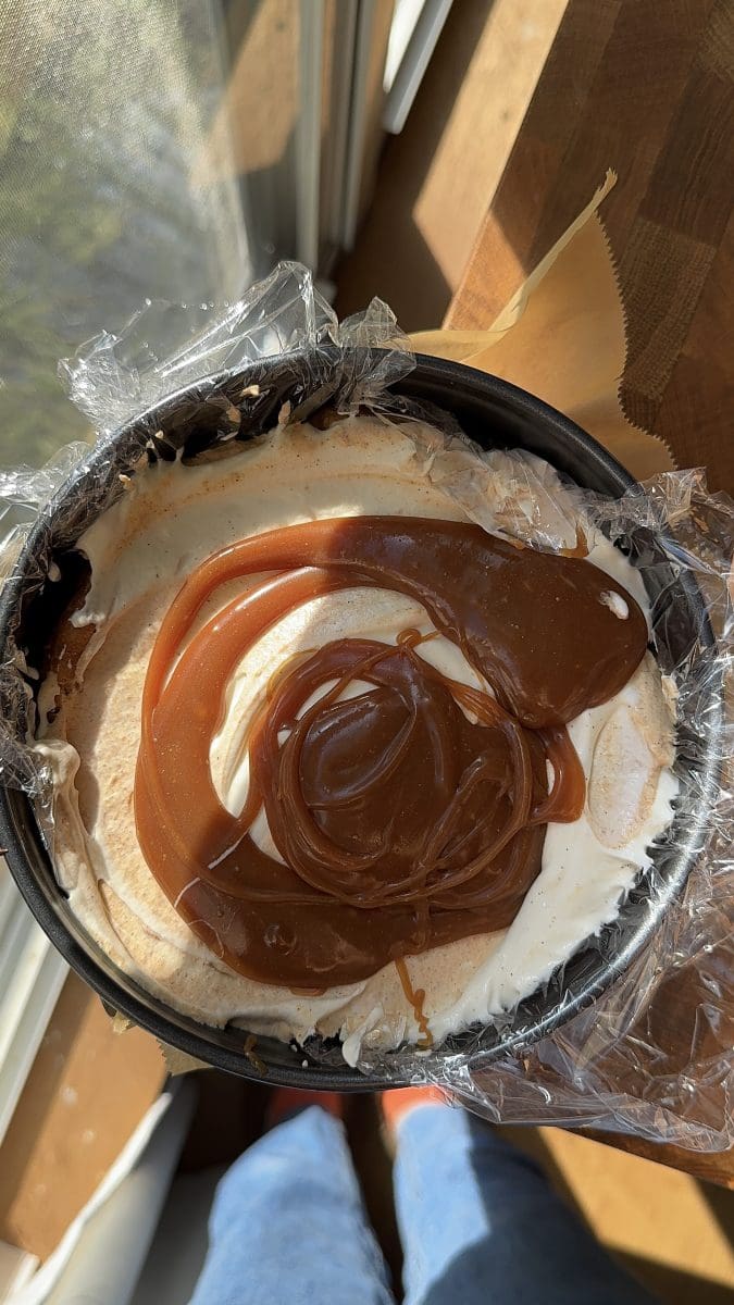 Assembling the pumpkin caramel ice cream cake.