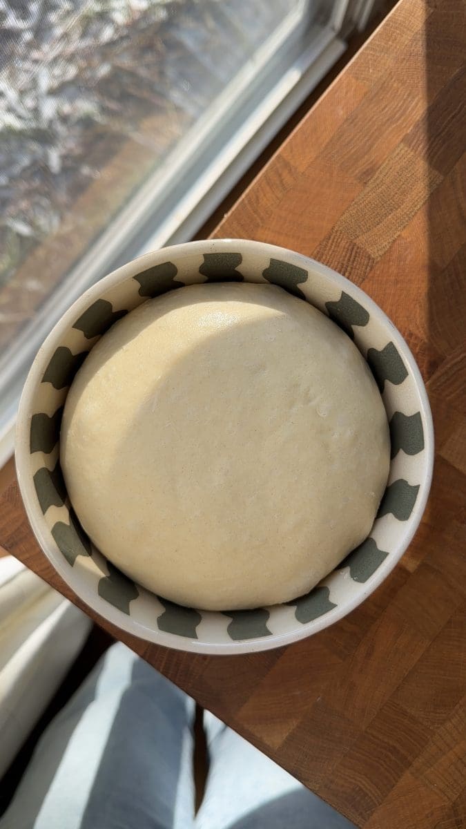 Brioche dough in a mixing bowl.