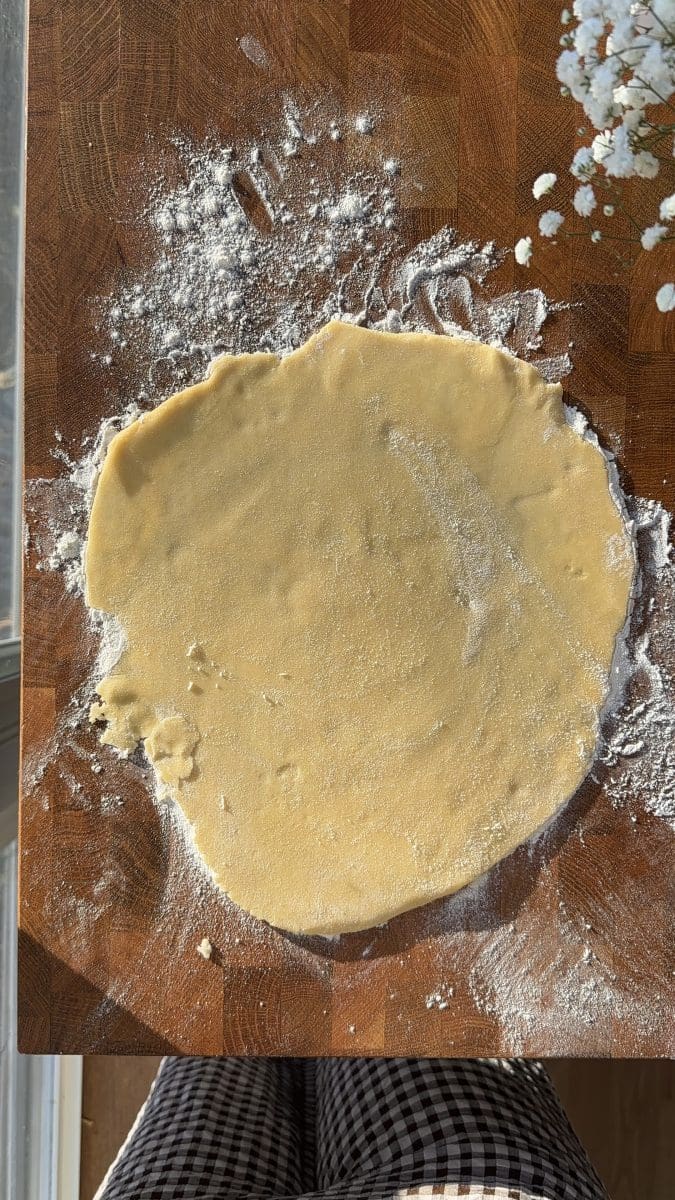 Rolling out the pie crust.