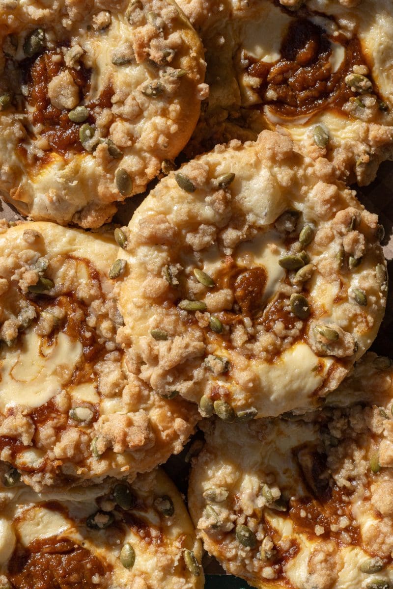 The pumpkin cheesecake brioche buns stacked on top of each other.