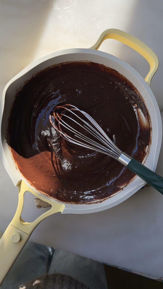 The chocolate custard in a saute pan.