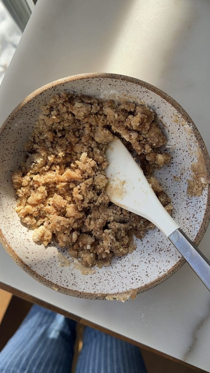 Brown sugar streusel in a mixing bowl.