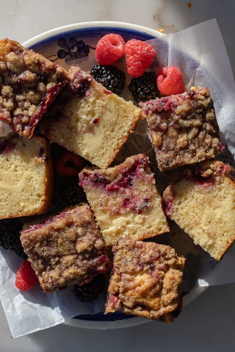 The berry cream cheese crumb cake on a serving plate.