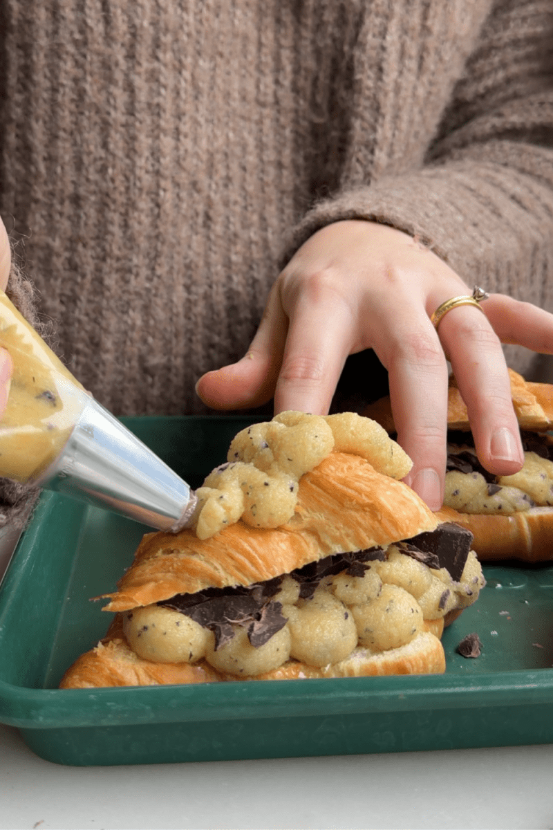 Piping frangipane on top of the croissants.